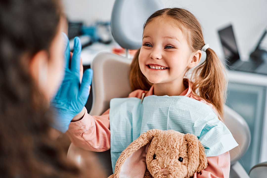 Why should children see their dentists regularly?